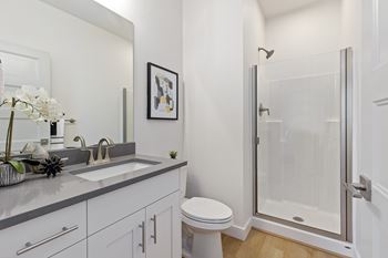 Bathroom with bathtub toilet and mirror